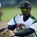 Huron D.J. Haynes collects balls and goes to the dugout on Monday, May 13. Daniel Brenner I AnnArbor.com